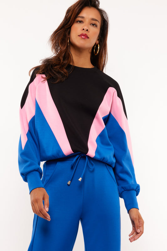 Fluresk trui zwart model Raya blauw sweater roze